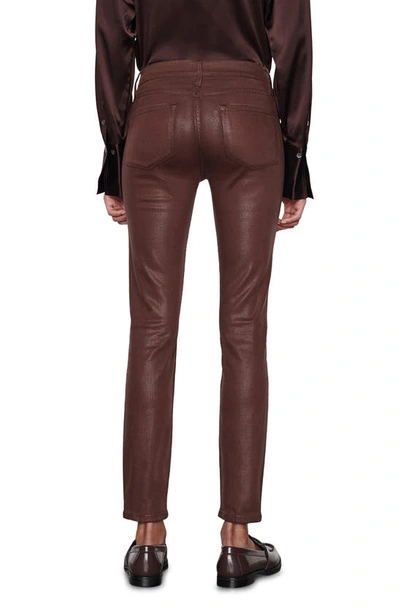 Shop Frame Le Skinny De Jeanne Coated Jeans In Mahogany