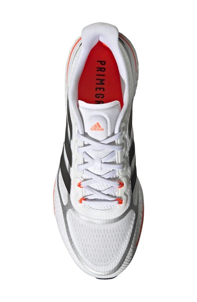 Shop Adidas Originals Supernova Running Shoe In Ftwr White/black/solar Red