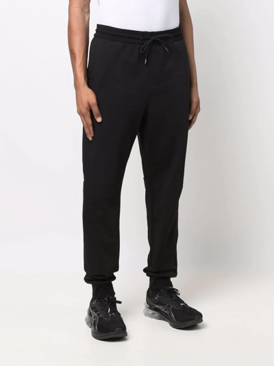 Shop Calvin Klein Logo-print Joggers In Black
