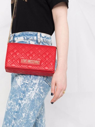 Shop Love Moschino Quilted Crossbody Bag In Red
