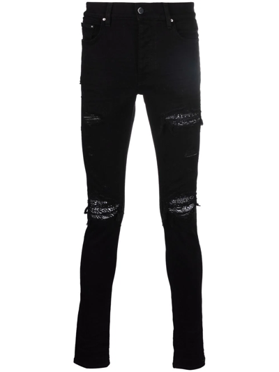 Shop Amiri Ripped-detailing Skinny Jeans In Black