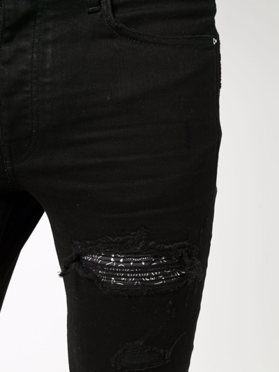 Shop Amiri Ripped-detailing Skinny Jeans In Black