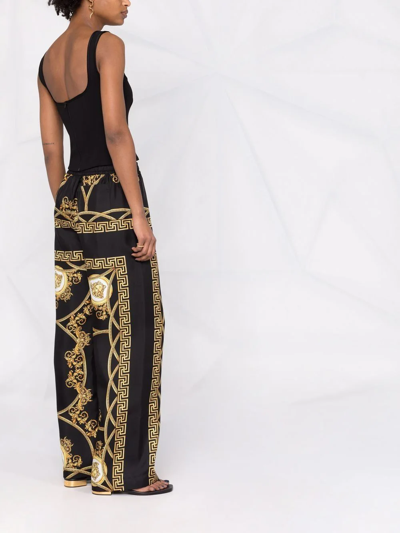 Shop Versace La Coupe Des Dieux-print Wide-leg Silk Trousers In Schwarz