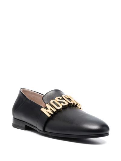 Shop Moschino Logo Plaque Almond-toe Loafers In Black
