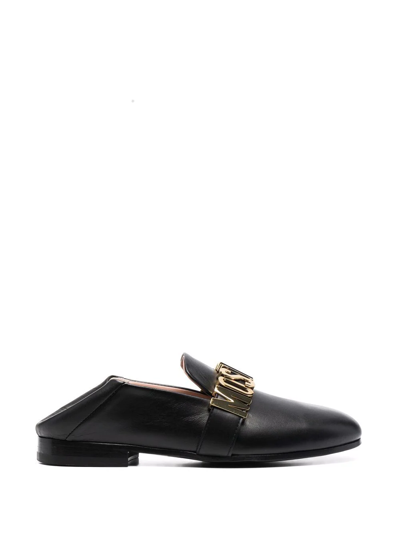Shop Moschino Logo Plaque Almond-toe Loafers In Black