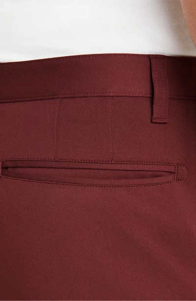 Shop Rhone Commuter Slim Fit Pants In Burgundy Red