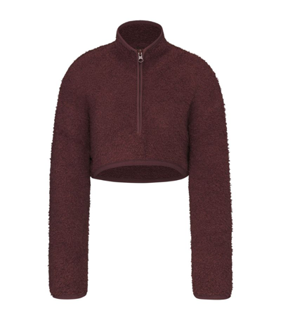 Shop Skims Cozy Knit Cropped Sweatshirt In Brown