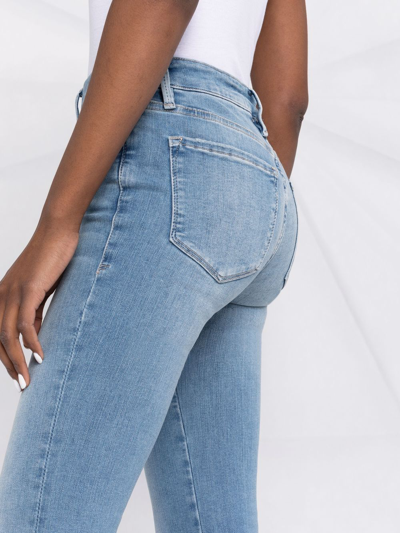 Shop Frame Le One Flared Jeans In Blue
