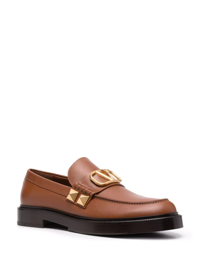 Shop Valentino Stud Sign Leather Loafers In Brown