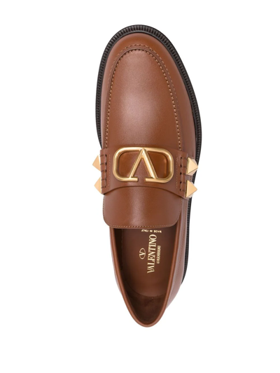 Shop Valentino Stud Sign Leather Loafers In Brown