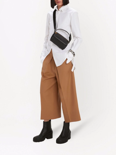 Shop Jw Anderson Pleat-front Wide-leg Cropped Trousers In Brown