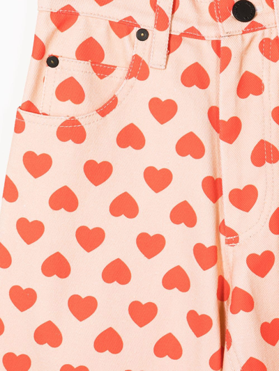 Shop Natasha Zinko Flared Heart-print Jeans In Orange