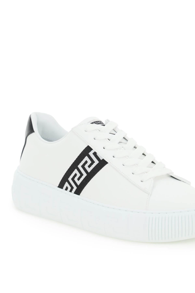 Shop Versace Leather Greca Sneakers In White,black