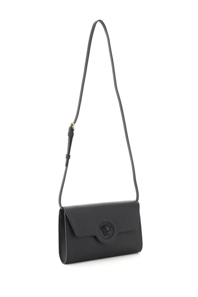 Shop Versace La Medusa Clutch-wallet In Black
