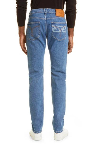 Shop Versace Grecca Straight Leg Jeans In Medium Blue
