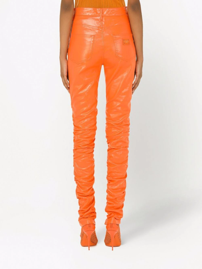 Shop Dolce & Gabbana Coated Cotton Pants In Orange