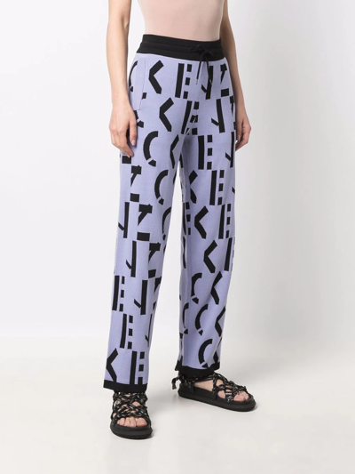 Kenzo All-over Logo-print Trousers In Violett