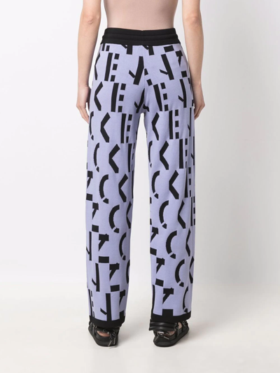 Kenzo All-over Logo-print Trousers In Violett