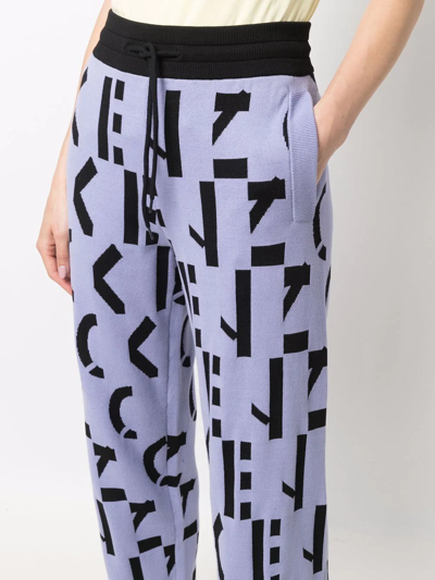 Kenzo All-over Logo-print Trousers In Violett