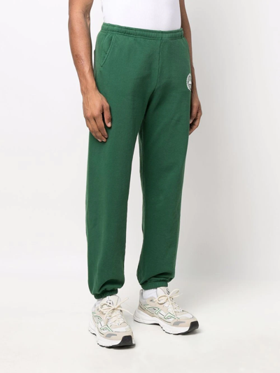 Shop Sporty And Rich Prince Print Track Trousers In Green