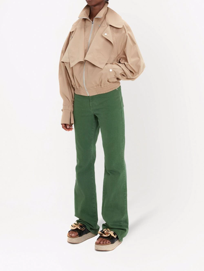 Shop Jw Anderson High-waisted Bootcut Jeans In Green