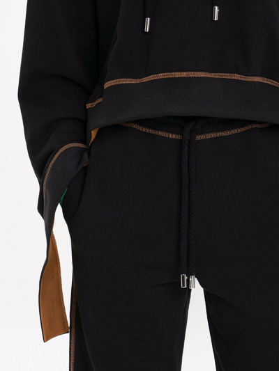 Shop Jw Anderson Tapered-leg Track Pants In Black