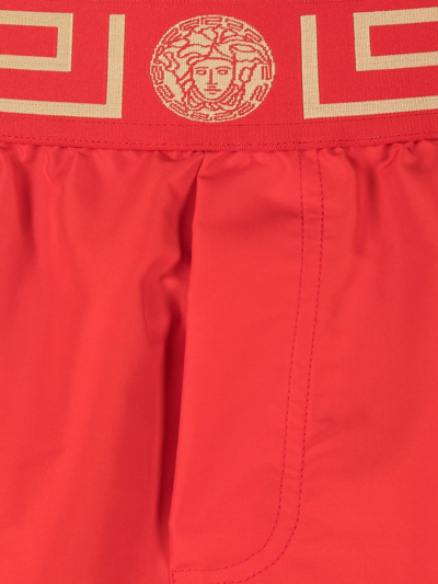 Shop Versace Greca Border Swim Shorts In Red