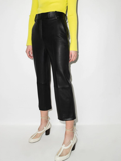 Shop Khaite Melie Cropped Leather Trousers In Black