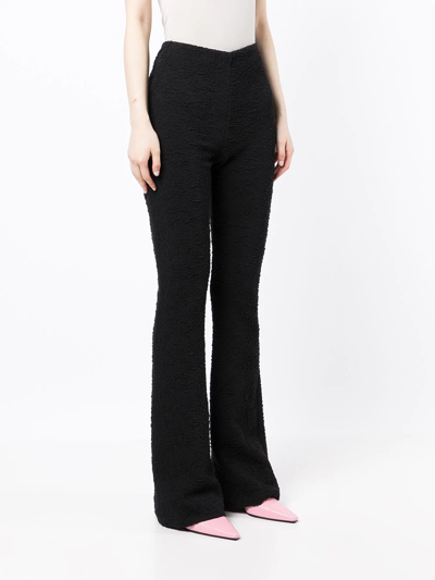 Shop Msgm Textured Flared Trousers In Black