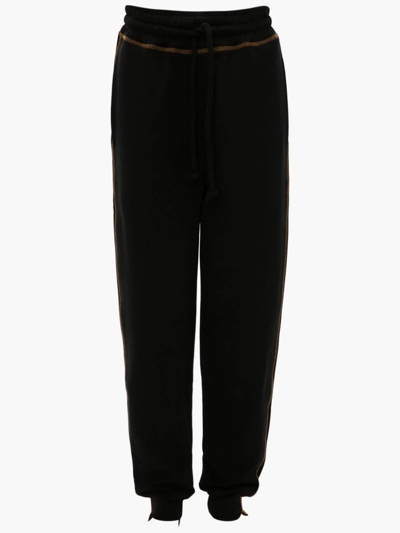 Shop Jw Anderson Tapered Track Pants In Black