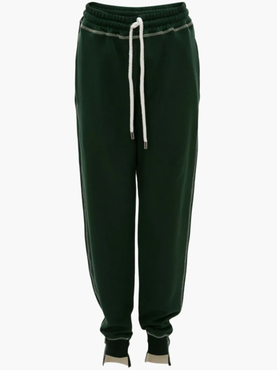 Shop Jw Anderson Tapered Track Pants In Green