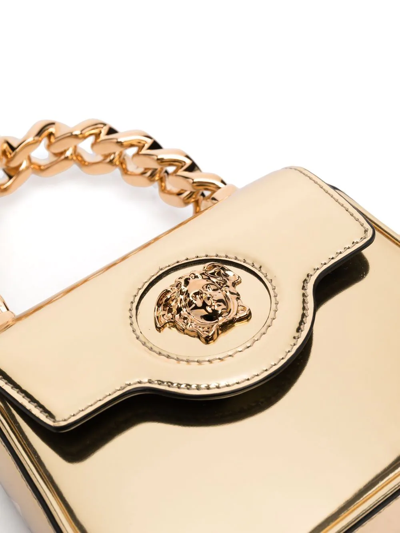 Shop Versace La Medusa Patent-leather Mini Bag In Gold