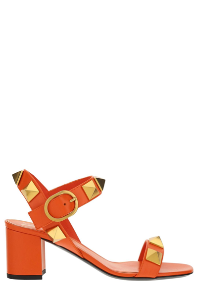 Shop Valentino Garavani Rockstud Ankle Strapped Sandals In Orange