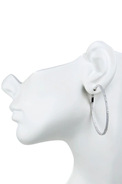 Shop Cz By Kenneth Jay Lane Cz Inside-out 50mm Hoop Earrings In Clear/silver