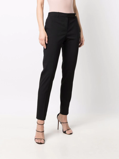 Shop Versace Medusa-fastened Tailored Trousers In Black