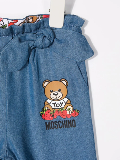 Shop Moschino Teddy Bear-print Tencel™ Trousers In Blue
