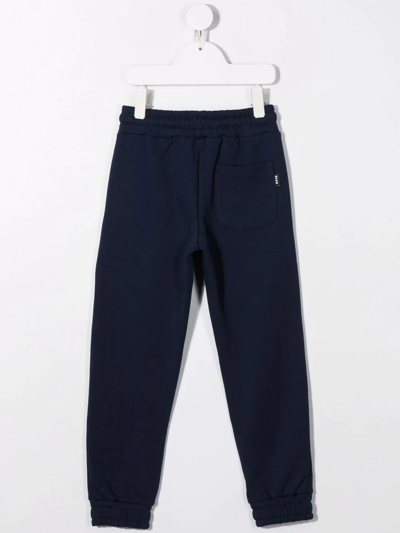 Shop Msgm Logo-print Tapered Track Pants In Blue