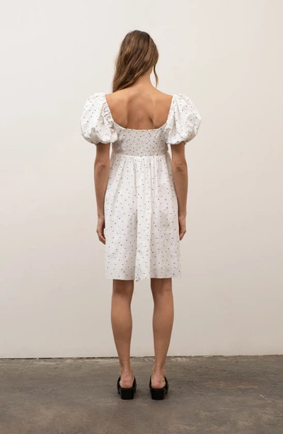 Shop Moon River Smocked Puff Sleeve Empire Waist Dress In Ivory
