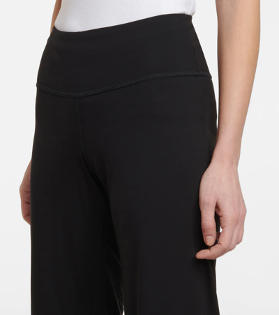 Shop Wolford Pure High-rise Flared Pants In Black