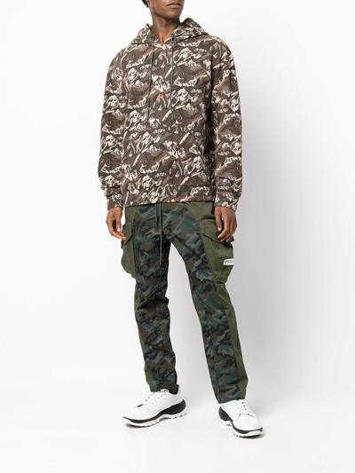 Shop Mostly Heard Rarely Seen Camouflage-panel Cargo Trousers In Green