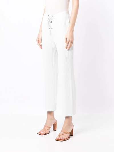 Shop Dion Lee Ribbed-knit Eyelet Lace-up Trousers In Blue