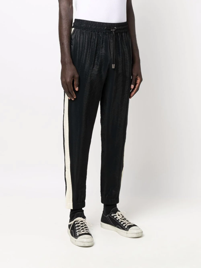 Shop Saint Laurent Side-stripe Tapered Trousers In Schwarz