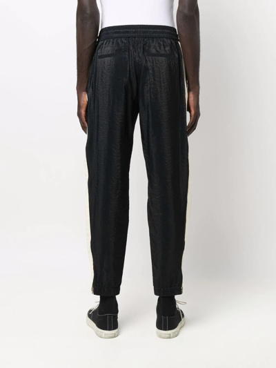 Shop Saint Laurent Side-stripe Tapered Trousers In Schwarz