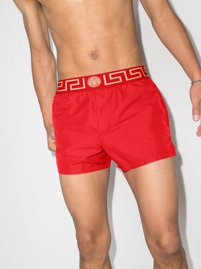 Shop Versace Greca Border Swim Shorts In Rot