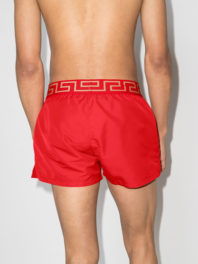 Shop Versace Greca Border Swim Shorts In Rot