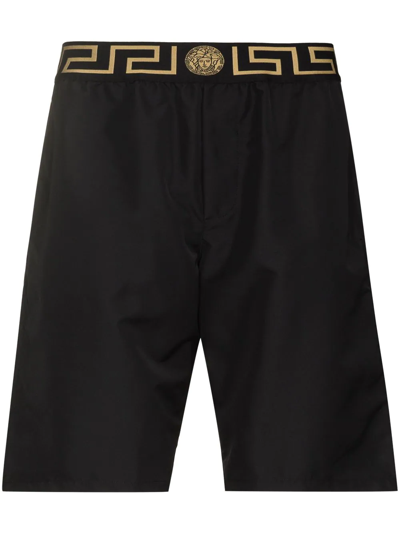 Shop Versace Greca Border Swim Shorts In Schwarz