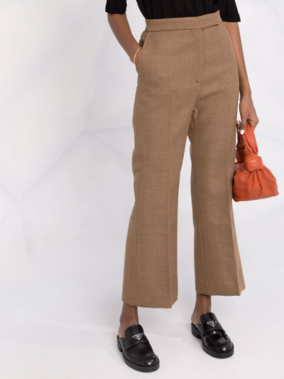 Shop Totême Cropped Kick-flare Wool Trousers In Braun
