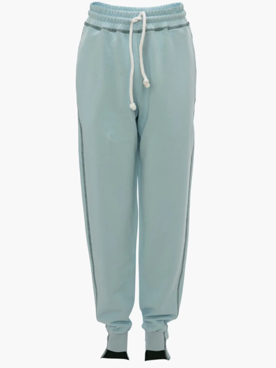 Shop Jw Anderson Tapered Track Pants In Blue