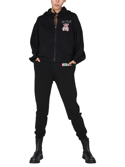 Shop Moschino Jogging Pants With Logo Print In Nero
