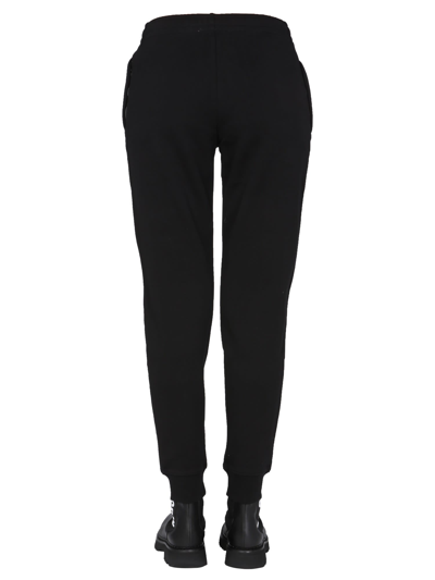 Shop Moschino Jogging Pants With Logo Print In Nero